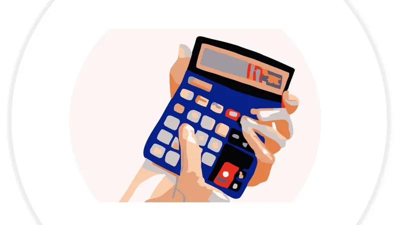 A hand holding a calculator for personal injury claim payouts
