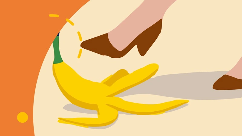 A woman having a supermarket slip and fall by stepping on a banana skin