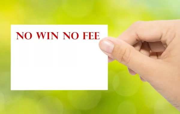 An injury lawyers hand holding a no win no fee card
